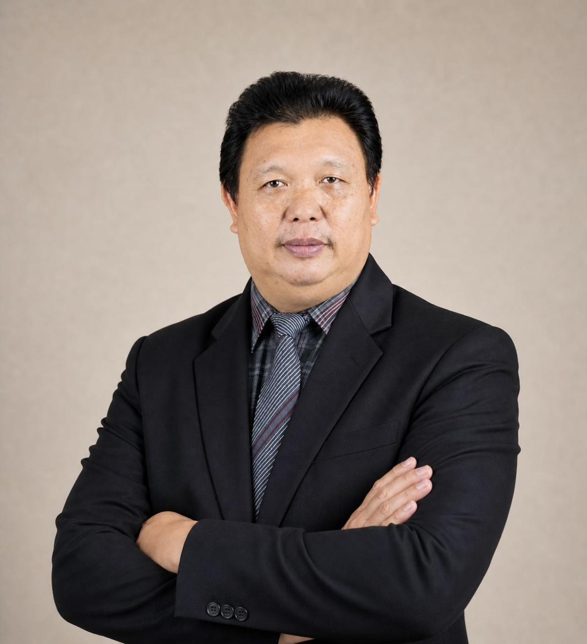 Dr. Drs. Harrychoon Angmalisang, M.Pd.